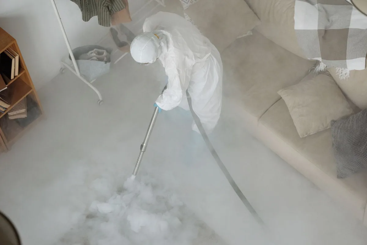 Biohazard cleanup technician in protective equipment, Palmyra, WI